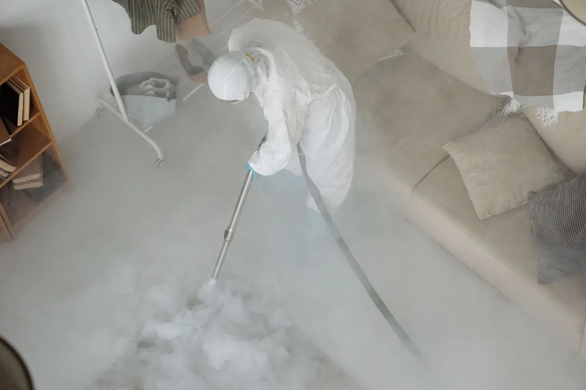 Biohazard cleanup technician in protective equipment, Genoa, NV